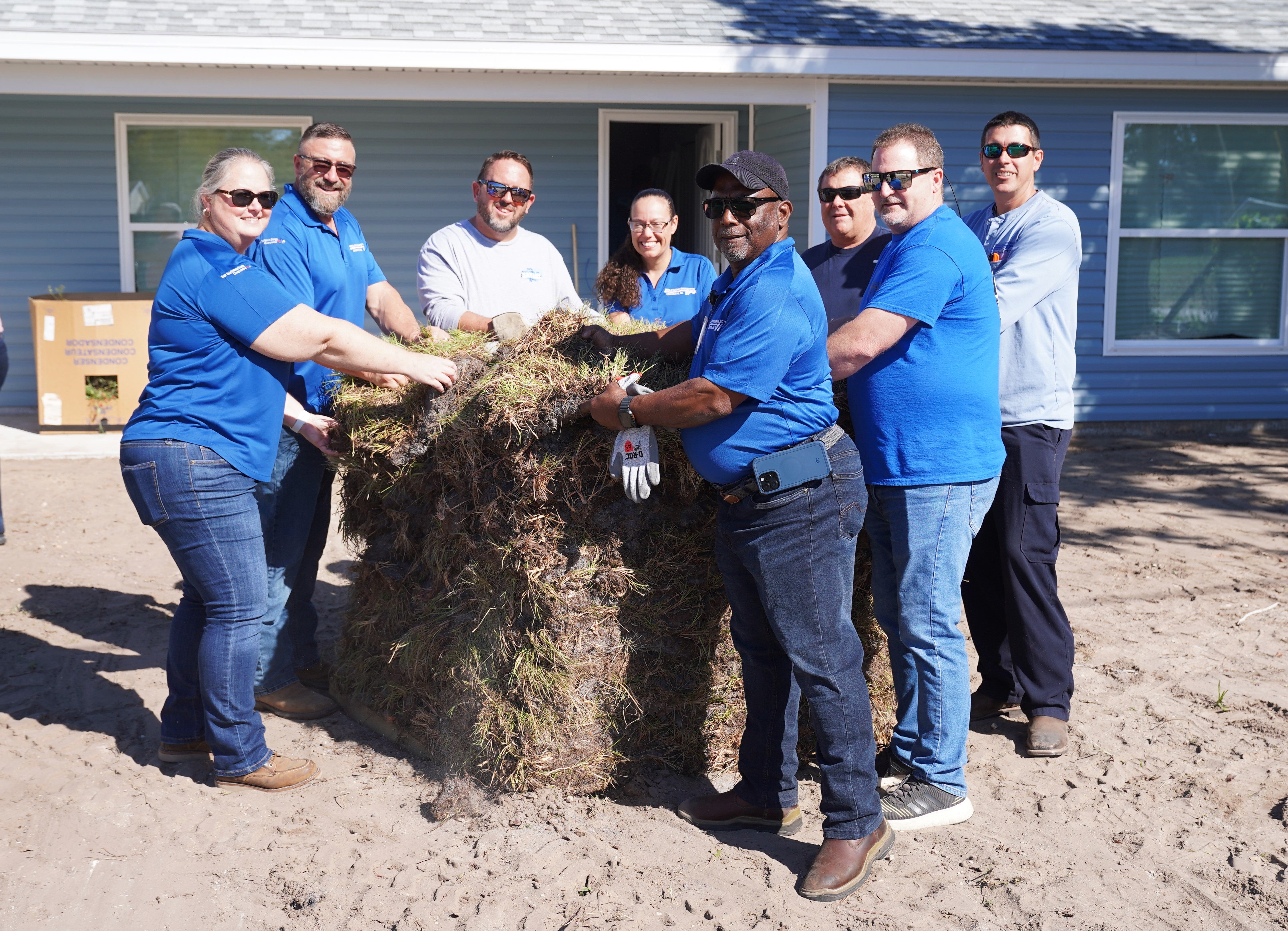 WREC employees lending a hand to bring a new Hernando County home to life.