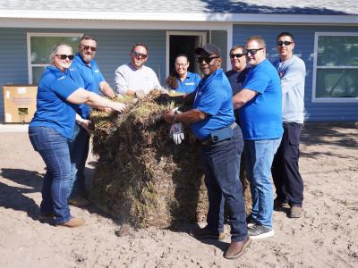 WREC employees lending a hand to bring a new Hernando County home to life.