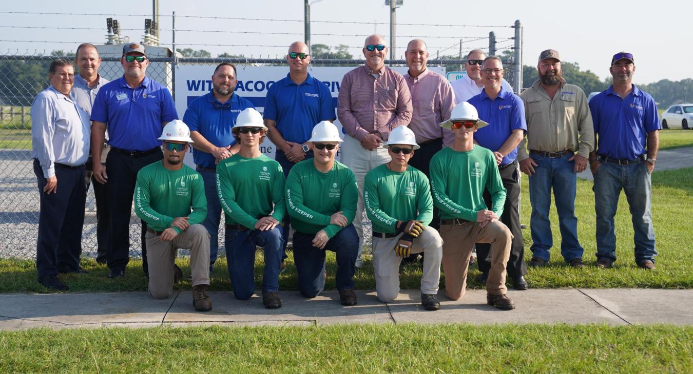 WREC Representatives with Linemen Graduates