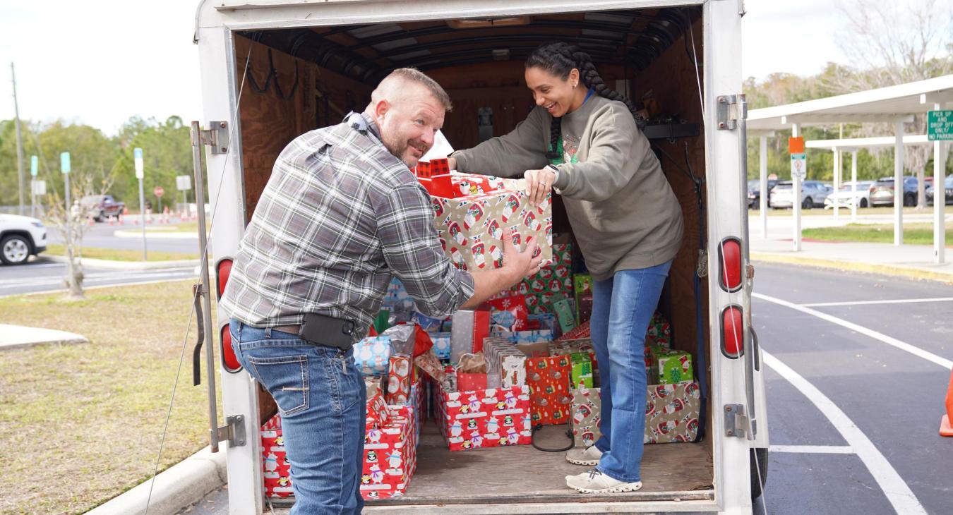 WREC Delivers Angel Tree Gifts to Quail Hollow Elementary School