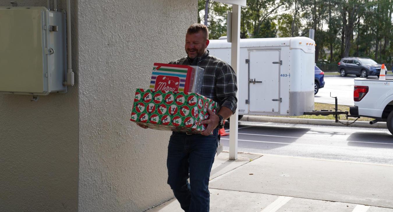 WREC Delivers Angel Tree Gifts to Quail Hollow Elementary School