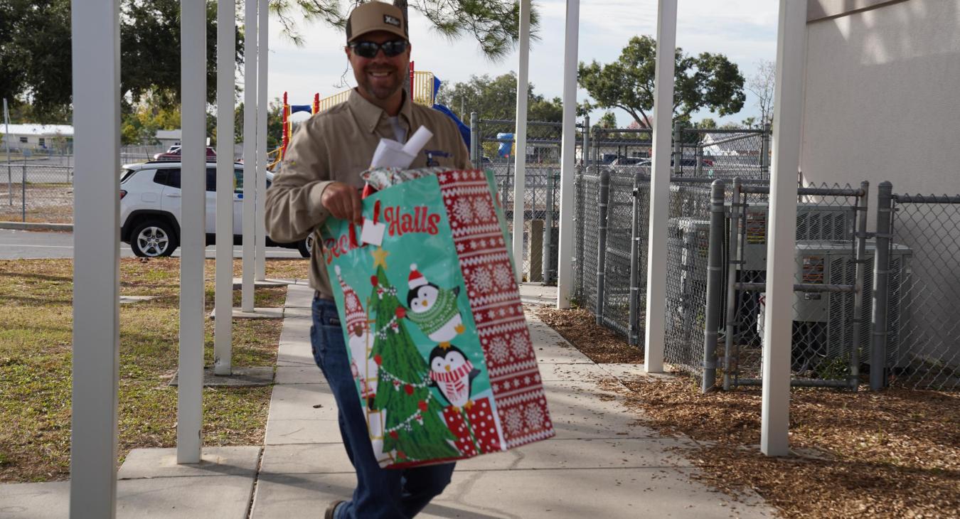 WREC Delivers Angel Tree Gifts to Fox Hollow Elementary School