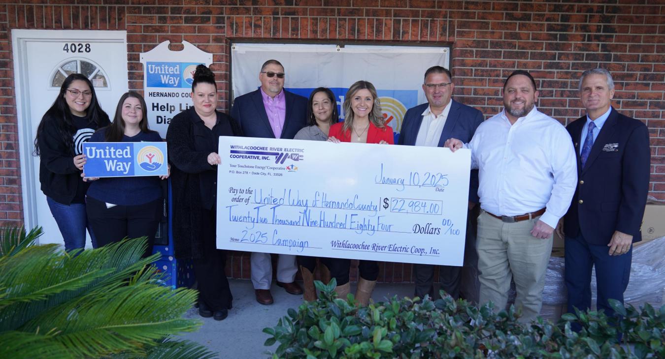 WREC presents United Way of Hernando County with a $22,984.00 donation check