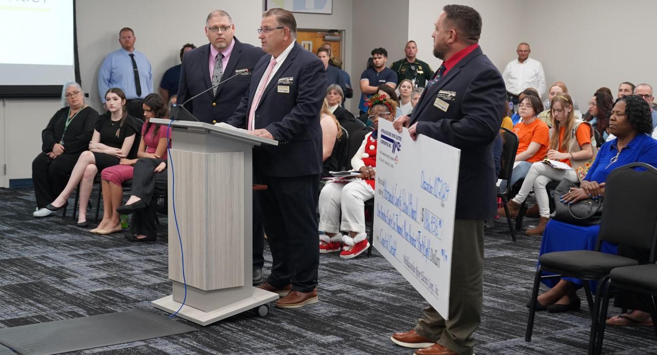 WREC Presents Hernando County School Board their Capital Credits check for $186,938.90