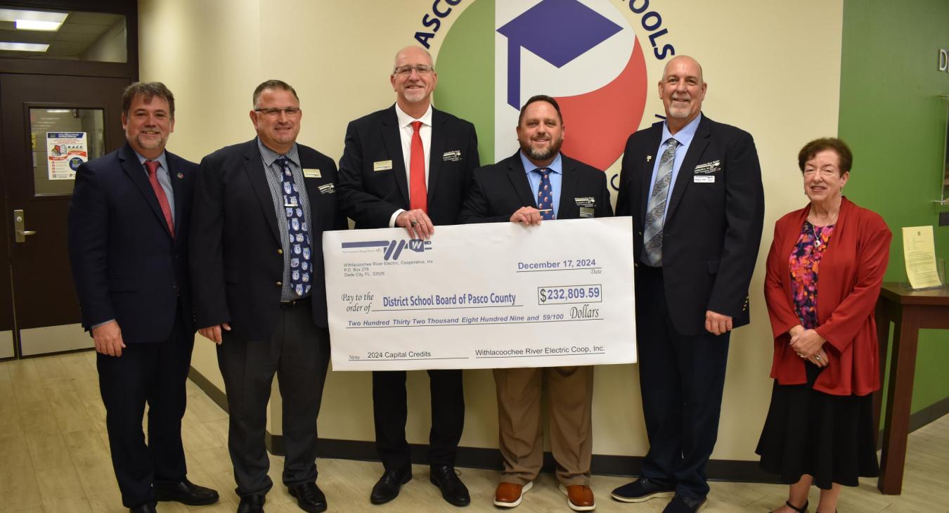 WREC Presents Pasco County School Board their Capital Credits check for $232,809.59