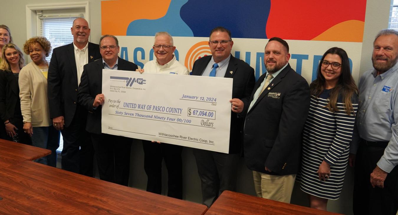 WREC presents United Way of Pasco County with a $67,094 donation check